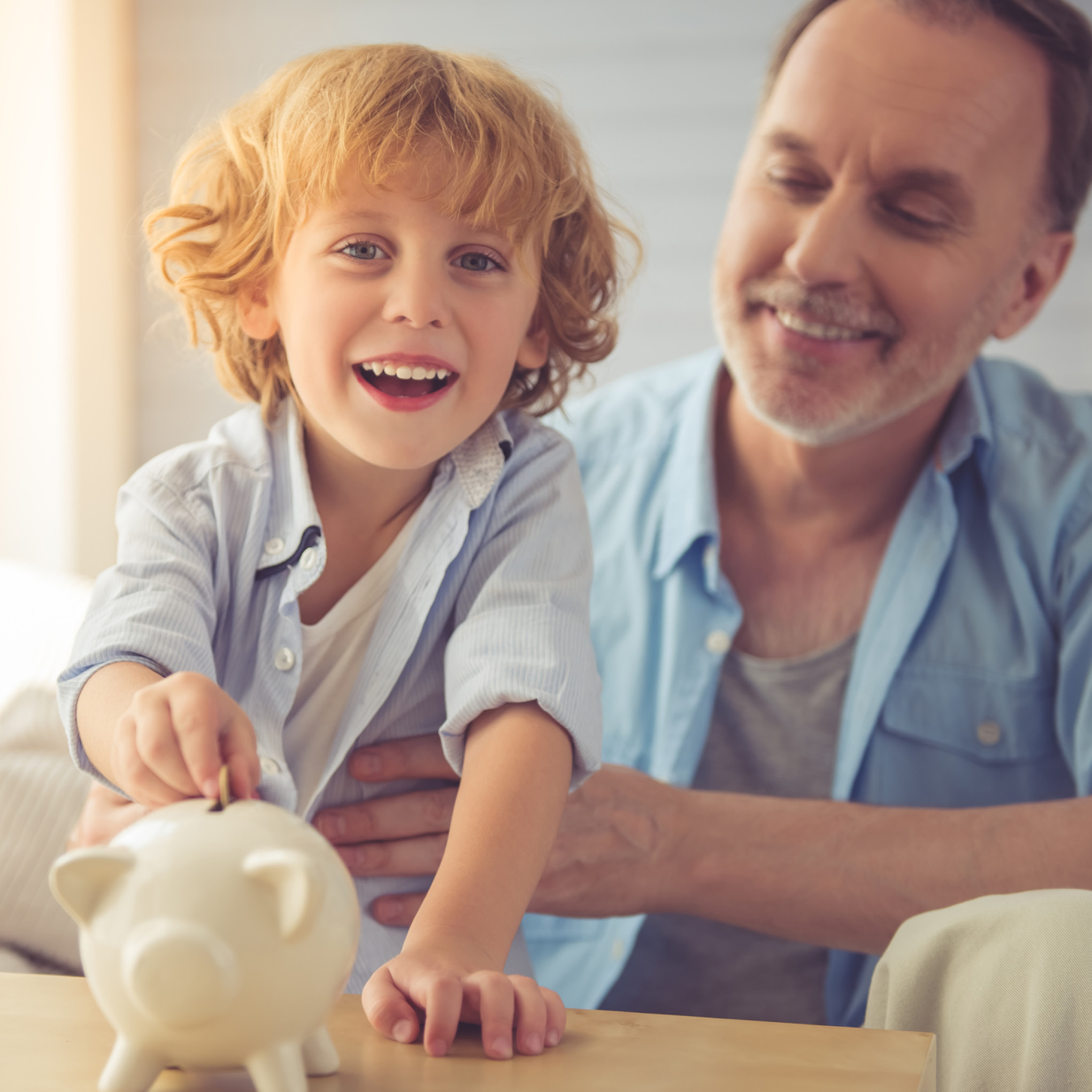 child and mother with piggy bank